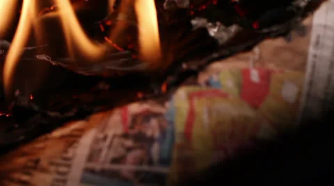 Burning Newspaper Being Put Out Stock Footage 25688429