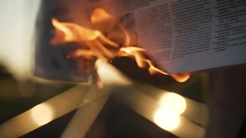 Burning newspaper in slow motion Stock Footage 251009528
