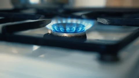 Burning old gas stove fire 1 burner, Natural Blue Gas flame lights up Stock Footage 125630331