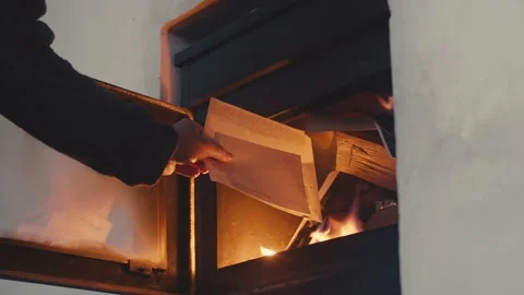 Burning old papers or documents in fireplace, old good times concept, Stock Footage 168045052