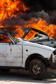 Burning old white car - Exercise firefighters Stock Photos
