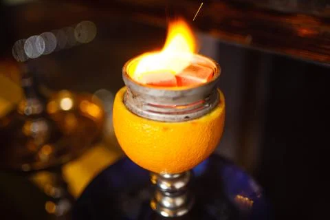 Burning orange hookah in cafe Stock Photos