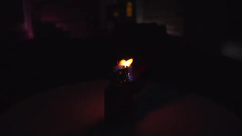 Burning Original Zippo lighter in a dark environment with wind Stock Footage 243540571