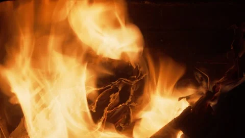 Burning paper documents in blazing Orange yellow flames close-up Stock Footage 321895564
