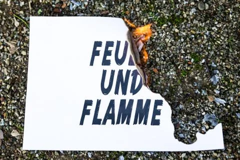 Burning paper on the ground 스톡 사진