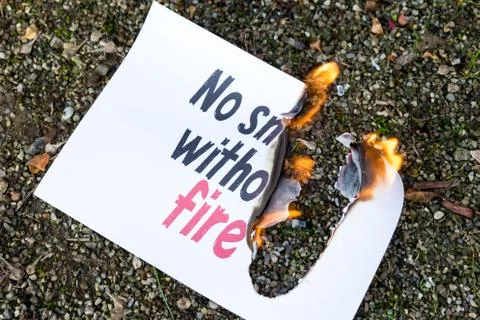 Burning paper on the ground 스톡 사진
