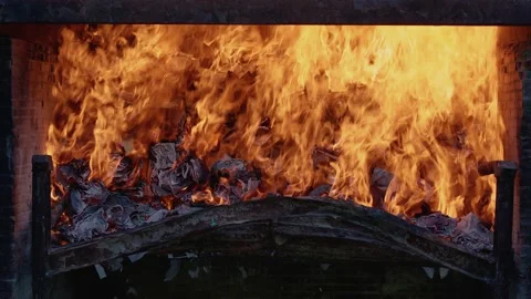 Burning paper in an oven 4K Stock Footage 202607190
