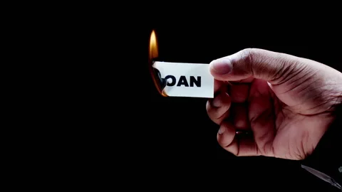Burning Paper Writing Loan on it Stock Footage 248692040