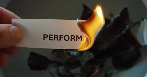 Burning “Performance” Paper – Destroying Productivity Concept Stock-Footage 334714296
