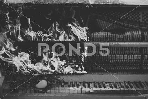 Burning piano, musical style, grunge instrument. Stock Photos