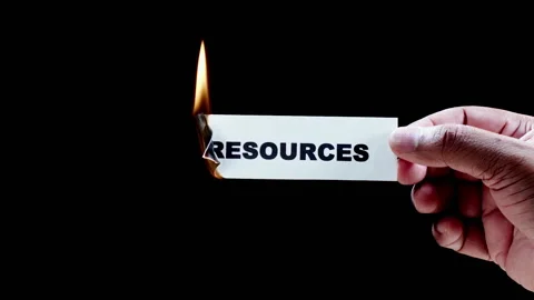Burning a piece of paper with with word Resources Stock Footage 248691430