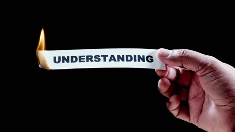 Burning a piece of paper with with word Understanding Stock Footage 248695268