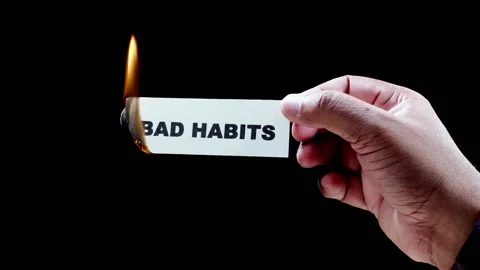 Burning a piece of paper with with words Bad habits Stock Footage 248690557