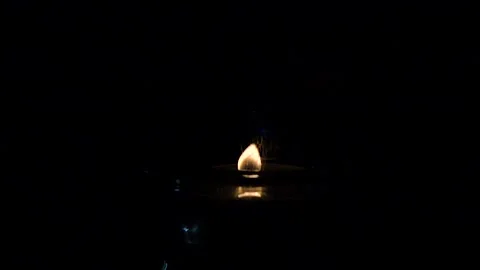 Burning pine needle resin in candle flame slow motion Stock Footage 229878340