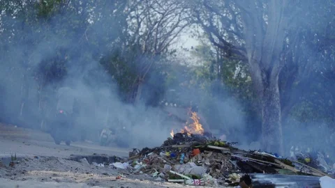 Burning Plastic Trash on the Streets in Bali Environment Stock Footage 119904242