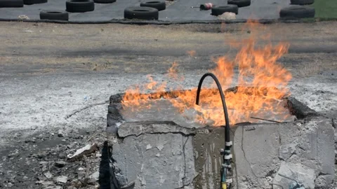 Burning pool for fire drill. Practice a fire drill outdoor Stock Footage 155865179
