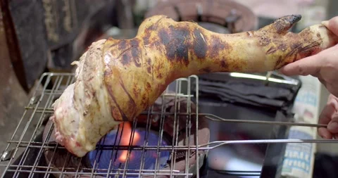 Burning the pork knuckle before cooking. Stock Footage 222582425