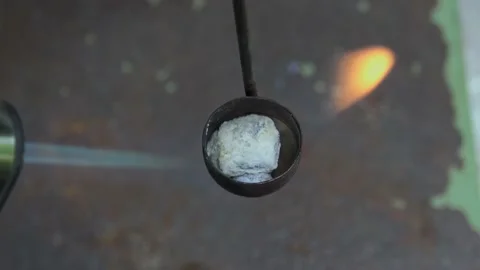 Burning potassium at high flame in cup Stock Footage 157755484