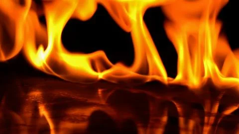 Burning power of the flame, Flames and burning sparks close-up, fire patter.. Stock Photos