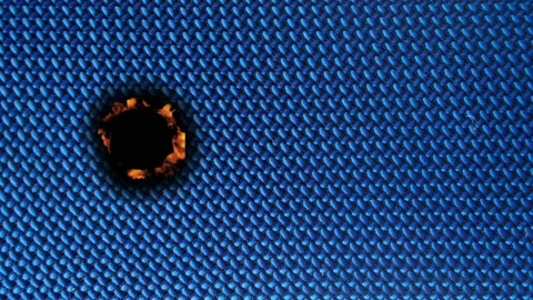 Burning process and damage to fabric under microscope at a lab Stock Footage 342831743