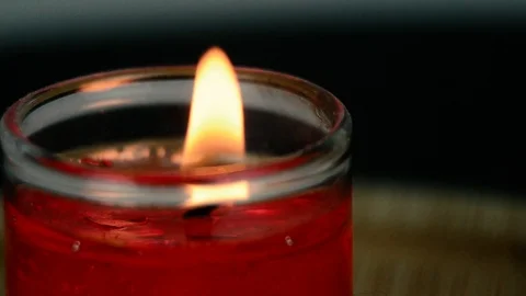 Burning red candle. Stock Footage 103805344