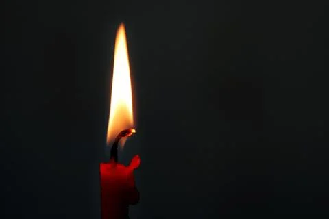 Burning red candle Stock-Fotos