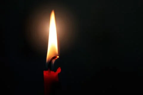 Burning red candle Stock Photos