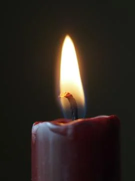 Burning red candle Stock Photos