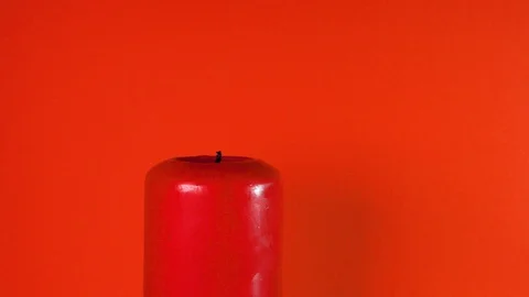 Burning Red Candle on a Red Background Stock-Footage 113402119