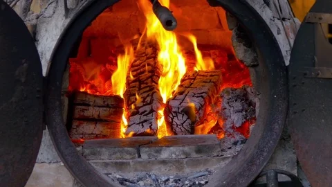 Burning red fire and logs in fireplace Stock Footage 78735689