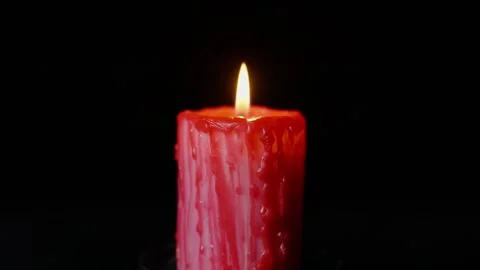 Burning Red Gothic Candle with Flickering Flame in Dark Atmosphere Stock Footage 325545266