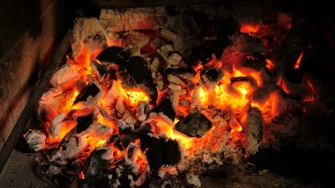 Burning red hot glowing coal in the Fireplace. Handheld camera.  Stock Footage 123620504