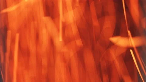 Burning red sparks of fire. Fast moving particles in a pipe at a factory. Stock Footage