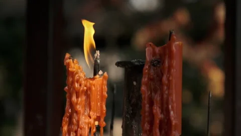 Burning red wax candle Видео 168928914