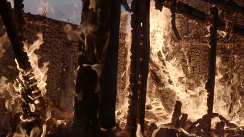 Burning remains of cabin 02 Stock Footage 165329872
