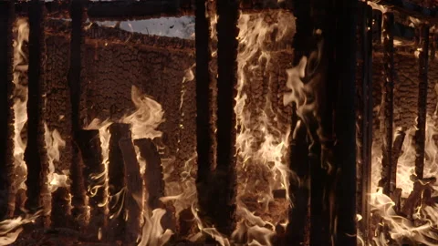 Burning remains of cabin Stock Footage 165329893
