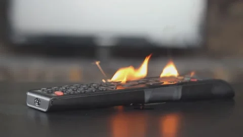 The burning remote control from the TV is on the table in the room, the equipmen Stock Footage 153654149