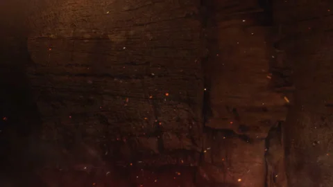 Burning Rock Wall Background with Fire Embers and Cinematic Sparks Loop Stock Footage 340375329