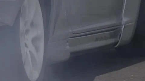 Burning rubber on the race track, close-up of the wheels, 4K slomo Stock Footage 270798919