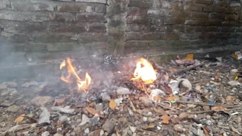 Burning rubbish causes air pollution Stock Footage 273634055