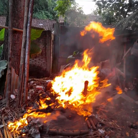 Burning rubbish causes air pollution Stock Footage 273634883