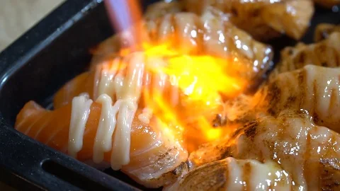 Burning Salmon Sushi Stock Footage 128609651