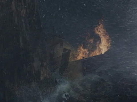 Burning Ship Bumping into a Rock on a Stormy Night Stock Footage 74232509
