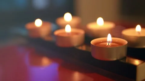 Burning small candles in low light, Memorial Day. Footage HD. Stock Footage 147692244