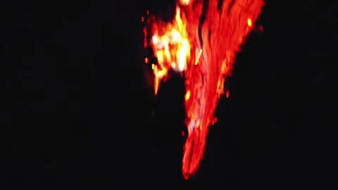 Burning smoldering tree trunk on a black background. Video stock 331861705