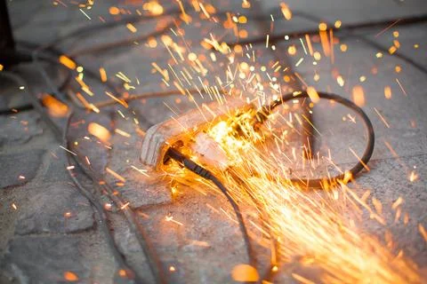 Burning spark electrical outlet shorting, danger Stock Photos