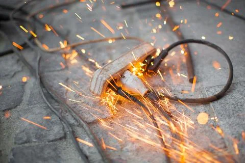Burning spark electrical outlet shorting, danger Stock Photos