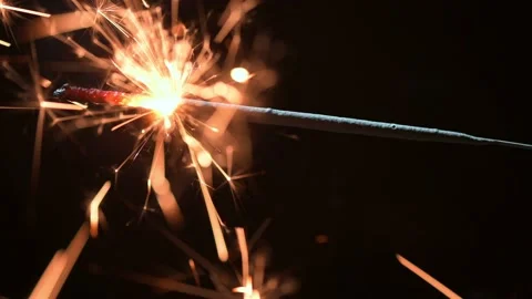 Burning sparkler on black background closeup Stock Footage 231395192