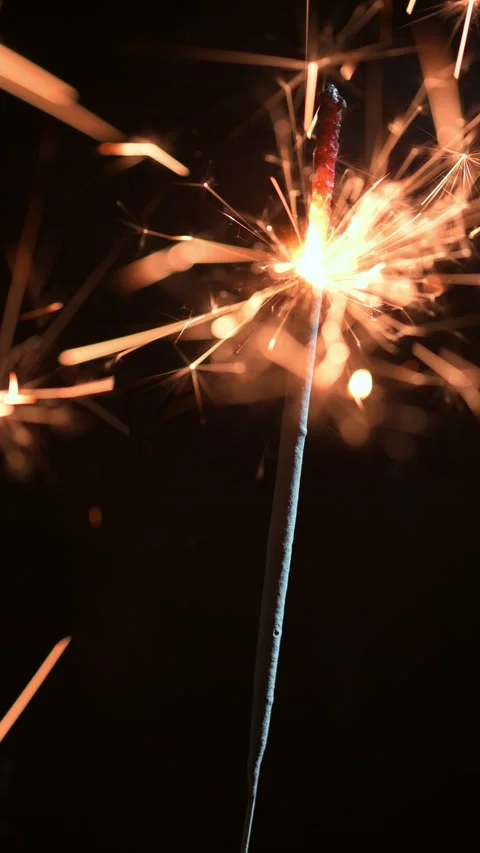 Burning sparkler on black background closeup Stock Footage 231397596