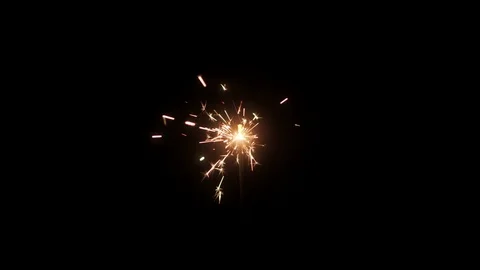 Burning sparkler on black background Stock Footage 99179712